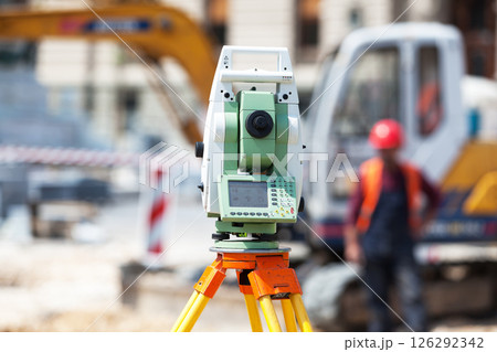 Theodolite or surveyor equipment tacheometer outdoors at construction site 126292342