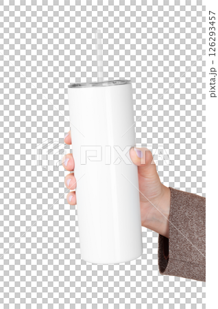 Female Hand Holding 20 oz skinny tumbler for sublimation. Travel Mug Straw Covers Cup with Lid. Isolated background Female Hand Holding 20 oz skinny tumbler for sublimation. Travel Mug Straw Covers Cup with Lid. Isolated background 126293457