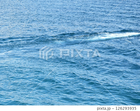 The texture of waves in the sea and ocean. Background, pattern with blue, blue water with a wave. Nature, reservoir. Waves and foam from ships, boats, speedboats and yachts. Hiking and surfing The texture of waves in the sea and ocean. Background, pattern with blue, blue water with a wave. Nature, reservoir. Waves and foam from ships, boats, speedboats and yachts. Hiking and surfing 126293935