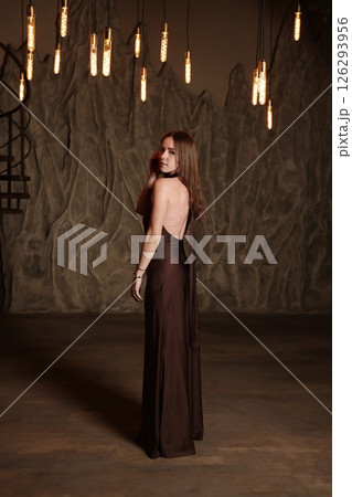 An Elegant Fashion Model Posed Gracefully in a Dramatic and Striking Setting, Captured Beautifully An Elegant Fashion Model Posed Gracefully in a Dramatic and Striking Setting, Captured Beautifully 126293956