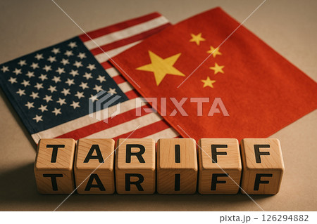 Tariff trade war concept between China and USA with flags and wooden cubes spelling tariff in front of both national symbols, symbolizing economic conflict 126294882