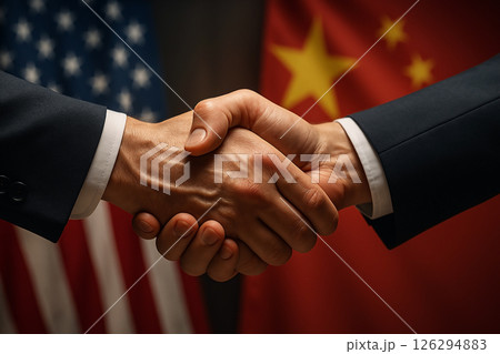 Handshake between businesspeople from China and USA in front of flags, representing trade agreement, diplomacy and international cooperation Handshake between businesspeople from China and USA in front of flags, representing trade agreement, diplomacy and international cooperation 126294883
