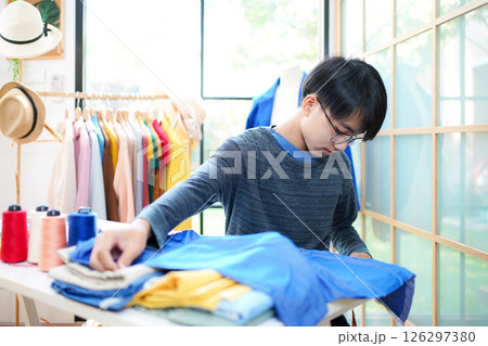 Trainee asian teenage man fashion designer  vocation and  education  126297380