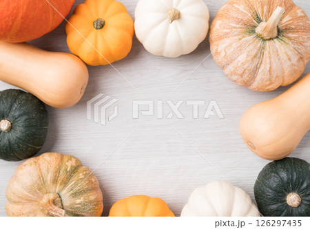 Various pumpkins on white background with copy space, Top view Various pumpkins on white background with copy space, Top view 126297435