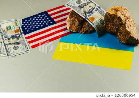 Flags and currency represent USA and Ukraine connection 126300954