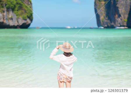 Woman tourist traveling and sightseeing in Krabi, Thailand, happy traveller enjoy at Maya Bay beach on Phi Phi island, Popular paradise island, destination, Southeast Asia Travel, vacation and holiday Woman tourist traveling and sightseeing in Krabi, Thailand, happy traveller enjoy at Maya Bay beach on Phi Phi island, Popular paradise island, destination, Southeast Asia Travel, vacation and holiday 126301379
