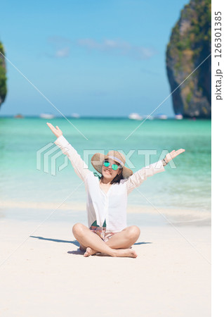 Woman tourist traveling and sightseeing in Krabi, Thailand, happy traveller enjoy at Maya Bay beach on Phi Phi island, Popular paradise island, destination, Southeast Asia Travel, vacation and holiday 126301385