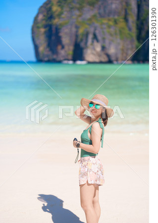Woman tourist traveling and sightseeing in Krabi, Thailand, happy traveller enjoy at Maya Bay beach on Phi Phi island, Popular paradise island, destination, Southeast Asia Travel, vacation and holiday 126301390