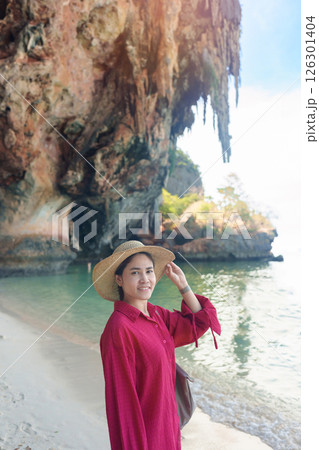 Woman tourist travel and sightseeing in Krabi, Thailand. happy traveller enjoy on beach at Phra nang Cave Beach near Railay Beach. summer trip, destination, Southeast Asia Travel and vacation concept 126301404