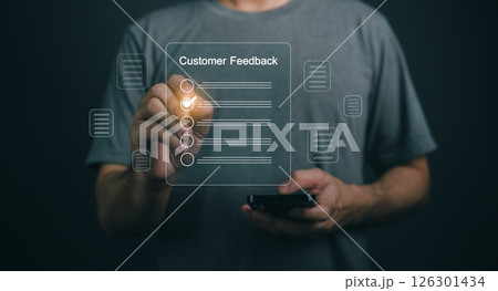 Close-up businessman hand professional individual engages with a smartphone, collecting customer feedback through a transparent survey interface, highlighting user interaction and modern technology. 126301434