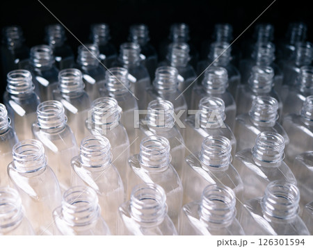 Close up Row of plastic drink water bottles for filling process. 126301594