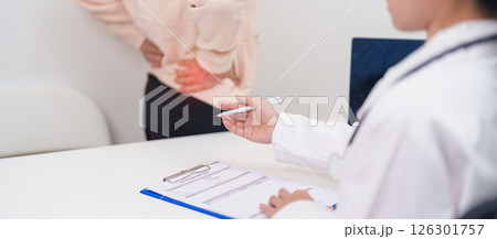 Elderly woman having back body ache and consulting doctor in hospital. Senior female with muscle pain due to Piriformis Syndrome, Low Back Pain and Spinal Compression. Office syndrome and medical Elderly woman having back body ache and consulting doctor in hospital. Senior female with muscle pain due to Piriformis Syndrome, Low Back Pain and Spinal Compression. Office syndrome and medical 126301757