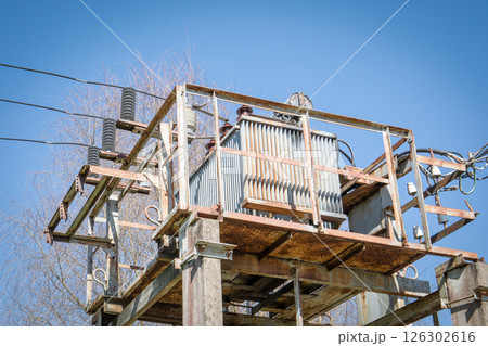 Electrical Transformer Station with Power Lines and Insulators in Industrial Setting Electrical Transformer Station with Power Lines and Insulators in Industrial Setting 126302616