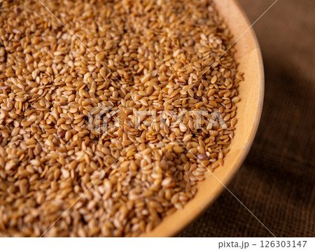 Organic golden flaxseed, linseed grains. Superfood high in fiber. 126303147