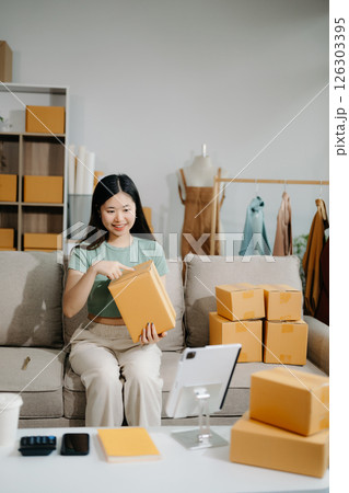 Small business entrepreneur SME freelance woman working at home office, BOX,tablet and laptop online, marketing, packaging, delivery 126303395