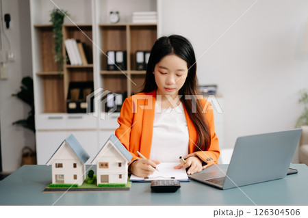 Considering buying a home, investing in real estate. Broker signs a sales agreement. agent, lease agreement, successful deal 126304506