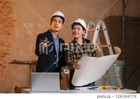 civil engineer and worker discussing issues at the construction site. civil engineer and worker discussing issues at the construction site. 126304778