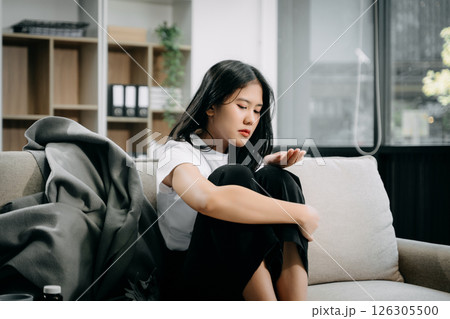 woman sit Depression Dark haired  pensive glance Standing by window and anxiety Copy space. 126305500