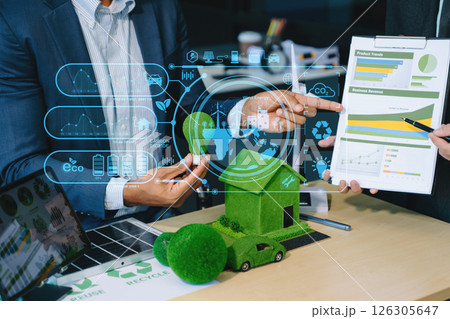 Business team people planning hand using laptop for working technology and business Net zero and carbon neutral concept. 126305647