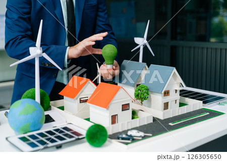 Business team people planning hand using laptop for working technology and business Net zero and carbon neutral concept. 126305650
