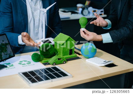 Business team people planning hand using laptop for working technology and business Net zero and carbon neutral concept. 126305665