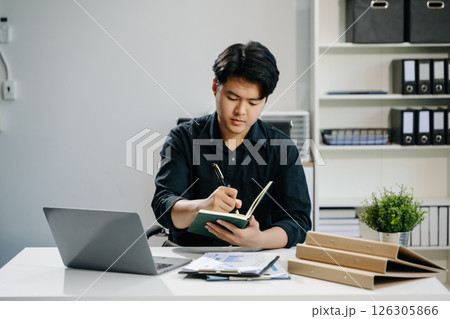 business man executive manager looking at laptop watching online webinar training 126305866