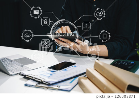 Web hosting concept, woman using computer, tablet and presses his finger on the virtual screen inscription Hosting Web hosting concept, woman using computer, tablet and presses his finger on the virtual screen inscription Hosting 126305871