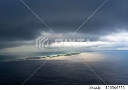 Aerial view of Rangiroa Atoll under a stormy sky, Tuamotus, French Polynesia Aerial view of Rangiroa Atoll under a stormy sky, Tuamotus, French Polynesia 126306753
