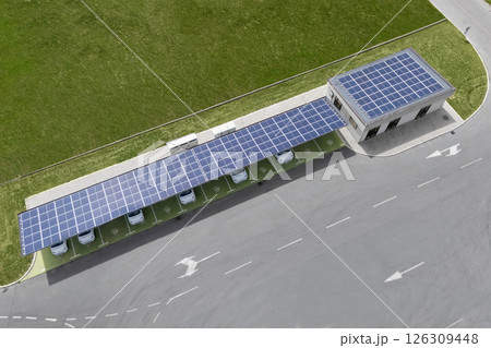 Electric car charging station that takes energy from solar panels. Solar canopy aerial view 126309448