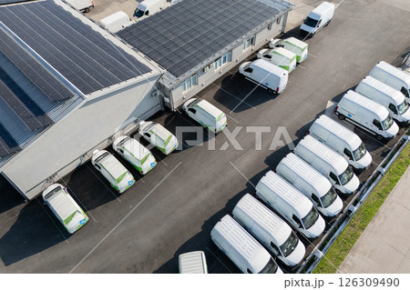 Electric delivery vans hub. Fleet of electric vehicles Electric delivery vans hub. Fleet of electric vehicles 126309490