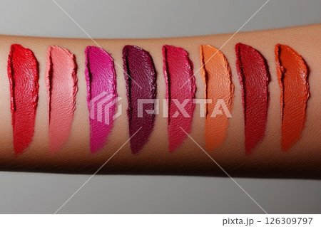 Smooth, colorful pebbles lining a lakes shore, reflecting the warm hues of a vibrant sunset sky Smooth, colorful pebbles lining a lakes shore, reflecting the warm hues of a vibrant sunset sky 126309797