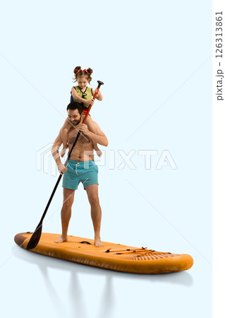 Smiling man, father standing on board, paddling with his daughter sitting on shoulders and holding paddle on sup board. 126313861