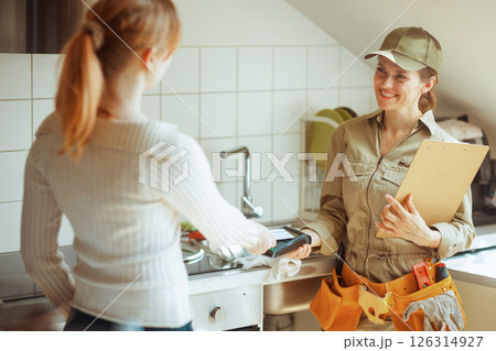 Paying the Plumber: Kitchen Service Transaction 126314927