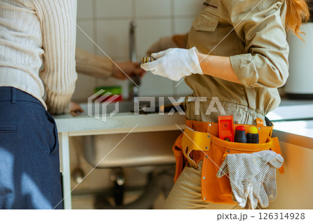 Female Plumber Consults Customer Female Plumber Consults Customer 126314928