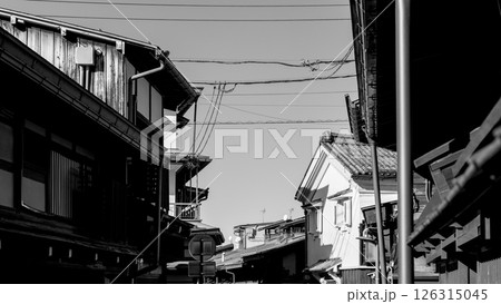 Monochrome street scene in Takayama historic Kamisannomachi district with visible power lines 126315045