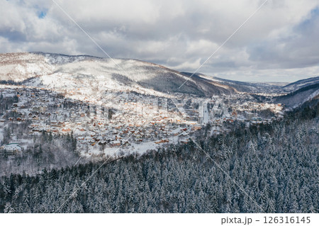 Little town in the Carpathian mountains at winter time. Majestic aerial landscape 126316145