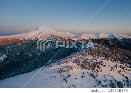 Winter aerial landscape of majestic Carpathian mountains. Background with sunset Winter aerial landscape of majestic Carpathian mountains. Background with sunset 126316176