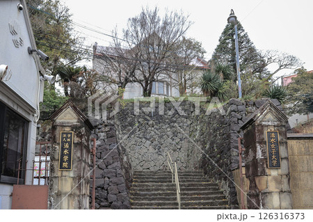 March 28 2025 Historic Stone Entrance of an Academy on a Wet Day March 28 2025 Historic Stone Entrance of an Academy on a Wet Day 126316373