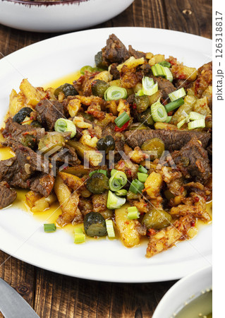 Azu is a traditional dish of Tatar cuisine on wooden surface. Azu is a traditional dish of Tatar cuisine on wooden surface. 126318817