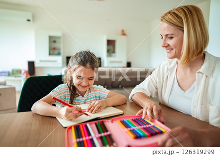 Creative moments between a mother and daughter at home 126319299