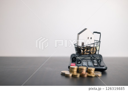 Finance bank tax expense accounting budget money businessman home for Business expense analysis saving use Financial calculate accountant close up calculator with graph chart hand write office desk 126319885