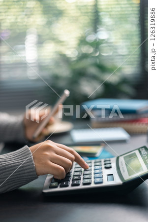Finance bank tax expense accounting budget money businessman hand use calculator Financial calculate accountant close up calculator with graph chart write office desk Business expense analysis saving Finance bank tax expense accounting budget money businessman hand use calculator Financial calculate accountant close up calculator with graph chart write office desk Business expense analysis saving 126319886