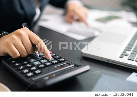 Finance bank tax expense accounting budget money businessman hand use calculator Financial calculate accountant close up calculator with graph chart write office desk Business expense analysis saving Finance bank tax expense accounting budget money businessman hand use calculator Financial calculate accountant close up calculator with graph chart write office desk Business expense analysis saving 126320041