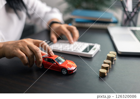 Finance bank tax expense accounting budget money businessman hand for Business expense analysis saving use car Financial calculate accountant close up calculator with graph chart write office desk 126320086