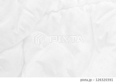 Close up top view of white bedding sheet and wrinkle messy blanket in bedroom after wake up in the morning. 126320391