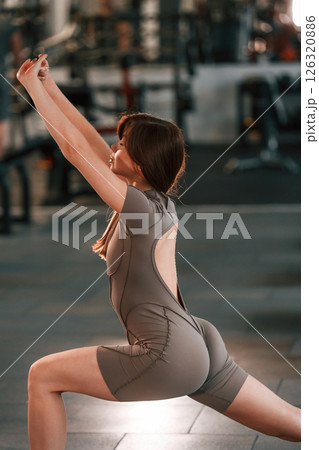 Fitness exercises. Beautiful woman with sport body type is in the gym 126320886