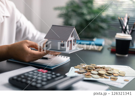 Finance bank tax expense accounting budget money businessman home for Business expense analysis saving use Financial calculate accountant close up calculator with graph chart hand write office desk 126321341