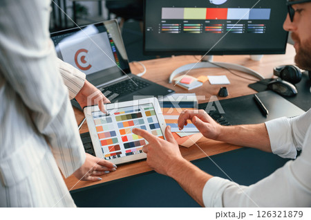 Creative job. Two designers are working together in the modern office 126321879