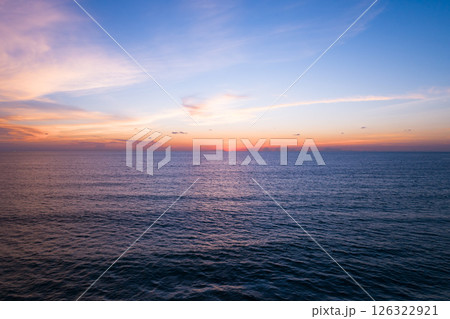 Aerial view sunset sky,Nature beautiful light sunset or sunrise over sea,Colorful dramatic majestic scenery sunset Sky with Amazing clouds and waves texture colorful sky cloud background 126322921