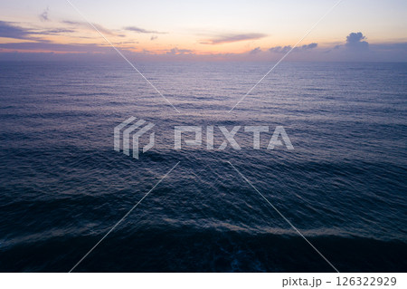 Aerial view sunset sky,Nature beautiful light sunset or sunrise over sea,Colorful dramatic majestic scenery sunset Sky with Amazing clouds and waves texture colorful sky cloud background 126322929
